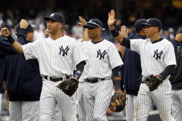 162700-yankees-players-jeter-cano-and-rodriguez-celebrate-after-the-yankees-d